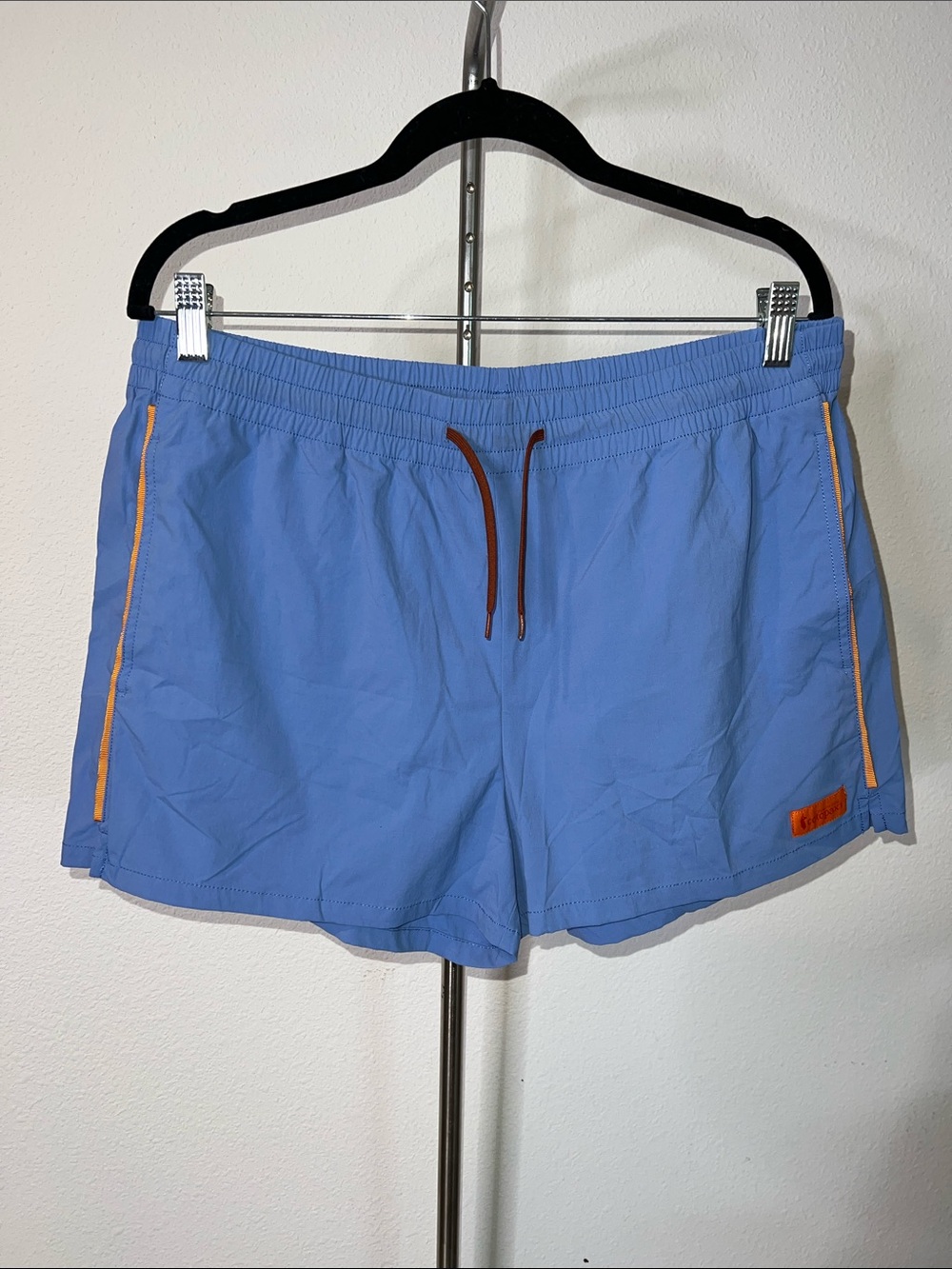 Cotopaxi Light Blue Brinco Swim Shorts with Orange Accents
